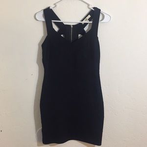Fitted, black mini with sexy cutouts
